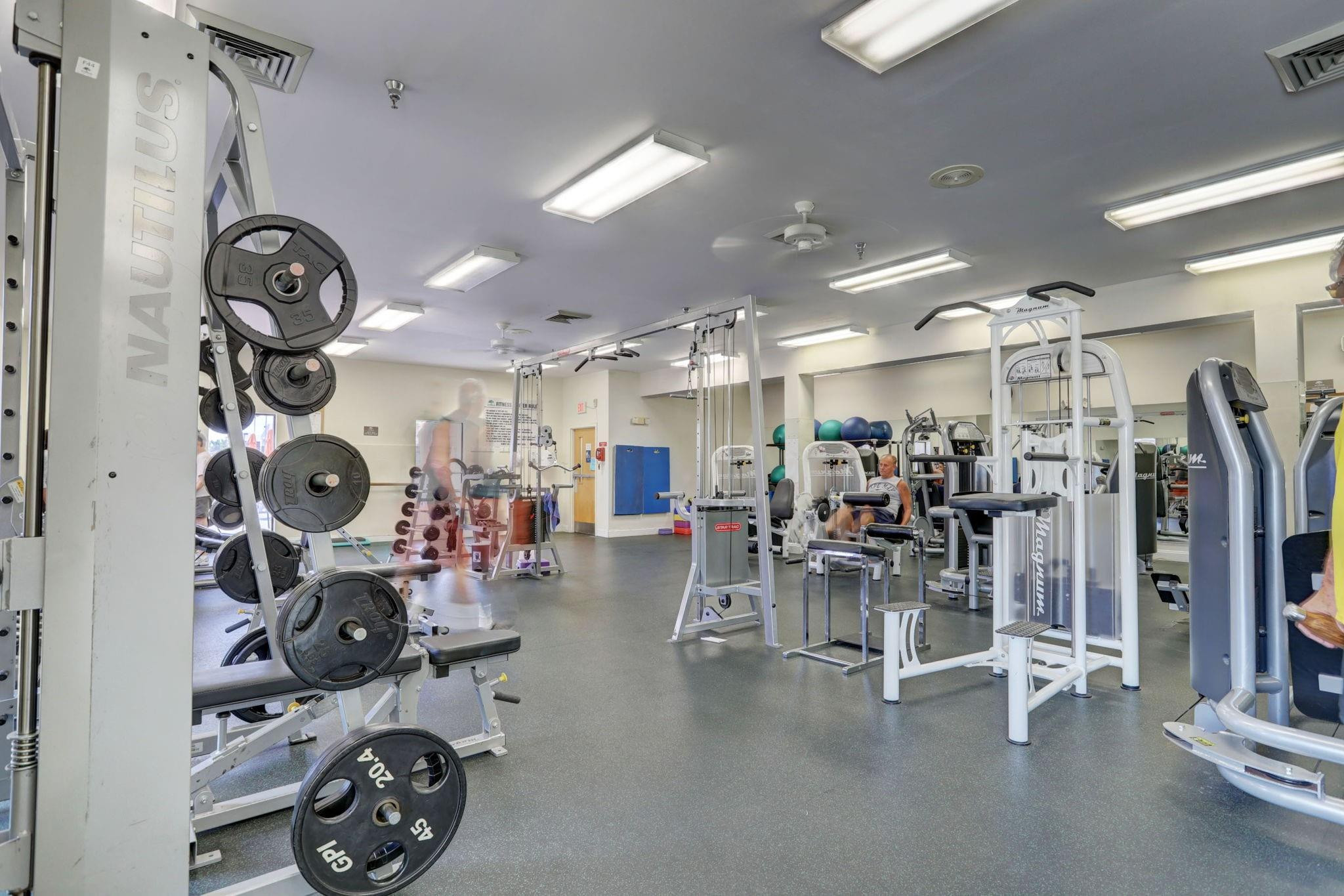 1801 Eleuthera Point, Unit E1 Coconut Creek, FL 33066 - Photo 48 of 50 a view of a room with gym equipment