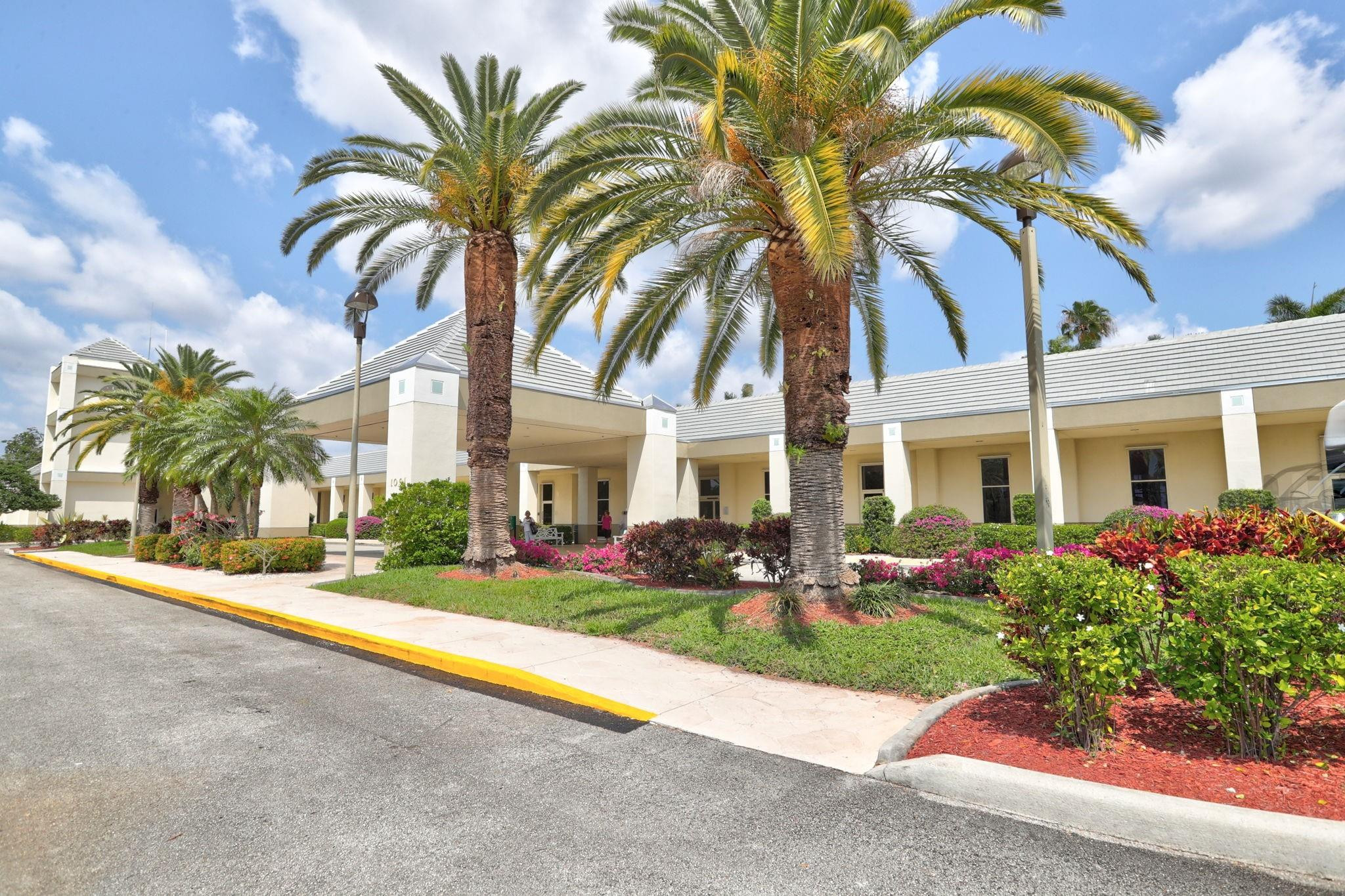 1801 Eleuthera Point, Unit E1 Coconut Creek, FL 33066 - Photo 50 of 50 a front view of house with yard and green space