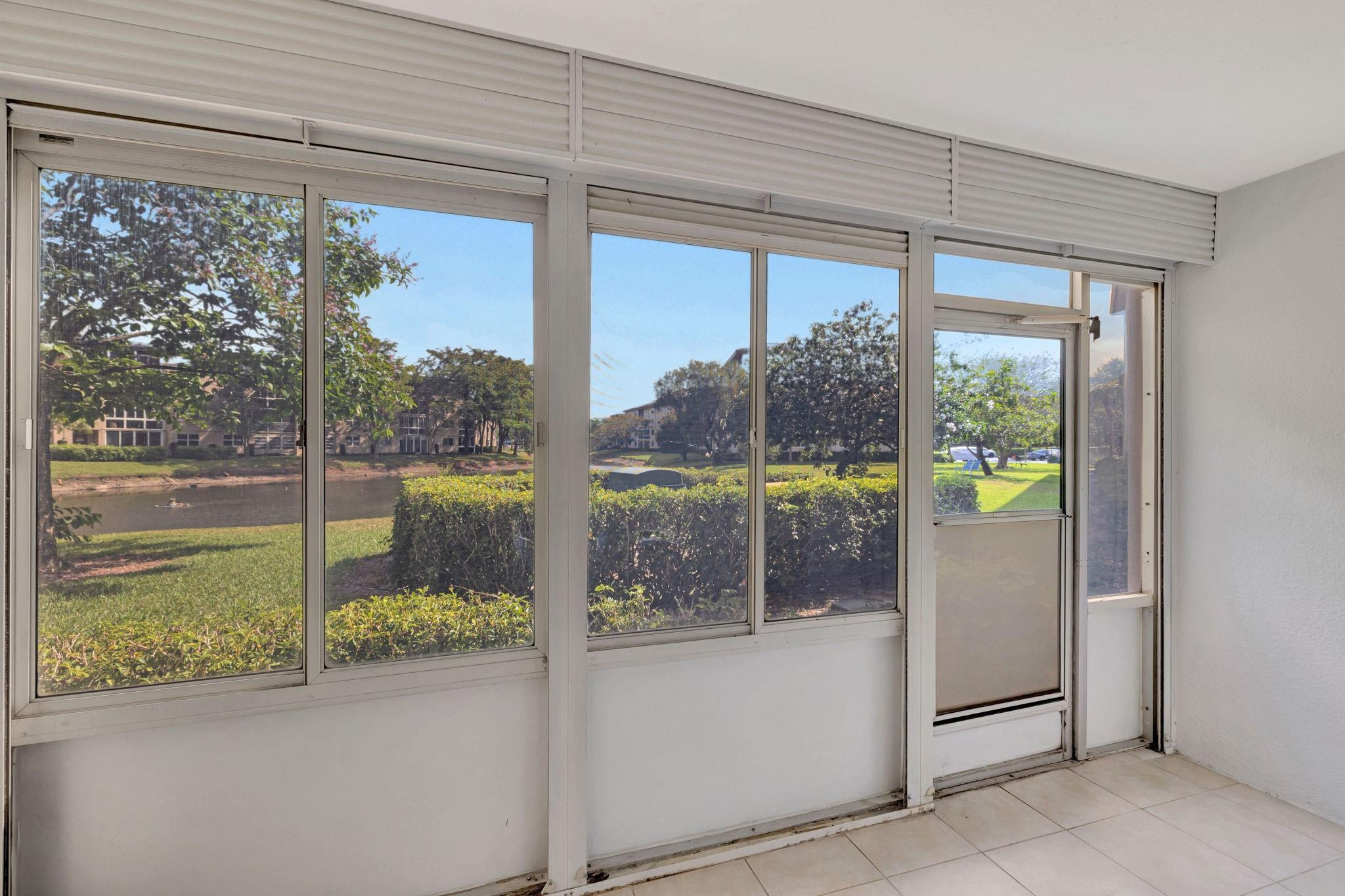 1801 Eleuthera Point, Unit E1 Coconut Creek, FL 33066 - Photo 10 of 50 a view of a room and window
