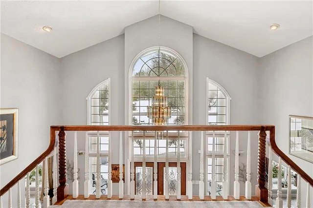 a view of an entryway with wooden floor and windows