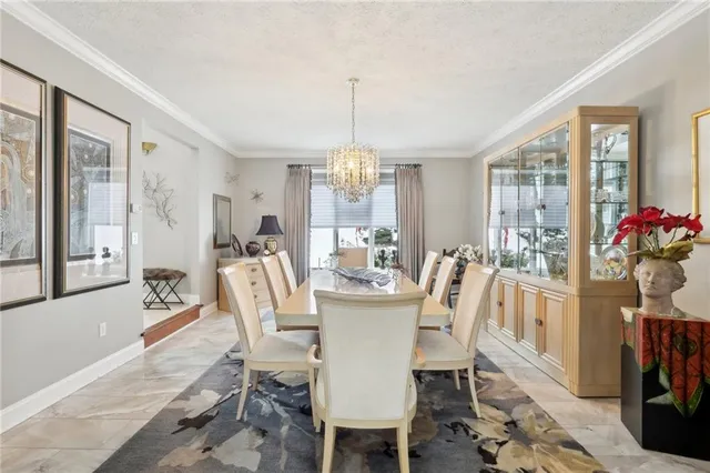 a dining room with furniture window and wooden floor