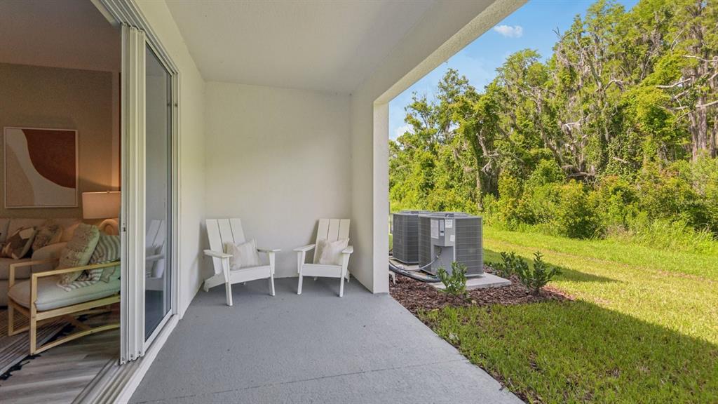 32467 Welling Blade Loop Wesley Chapel, FL 33545 - Photo 31 of 42 a view of a outdoor space with seating area