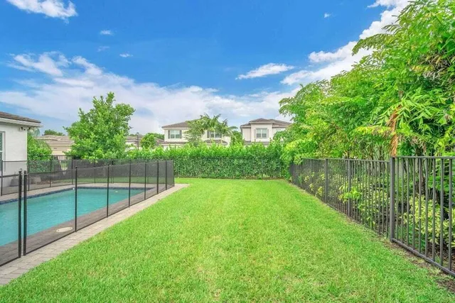 a view of a backyard with a lake view
