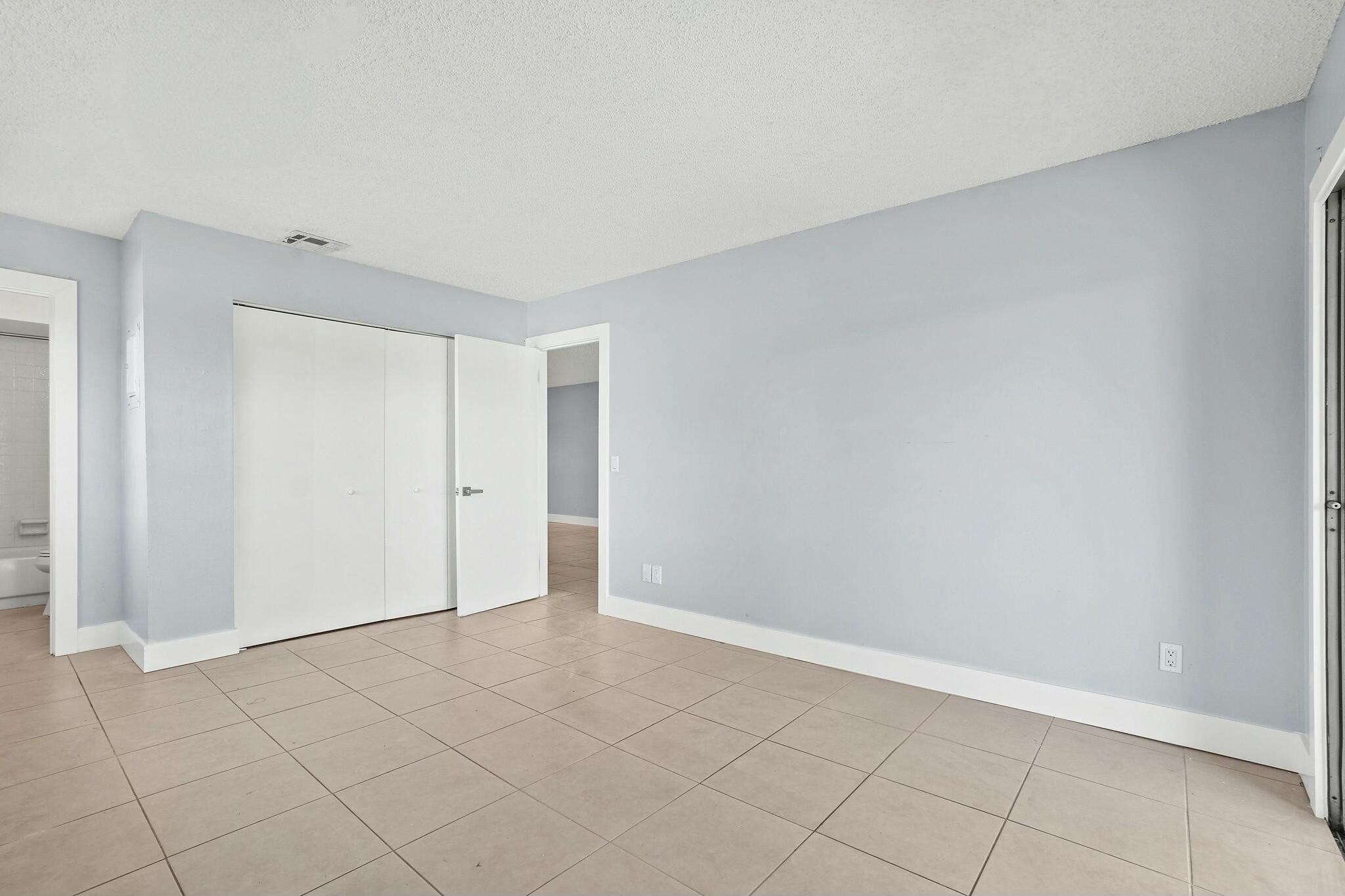 983 Northwest Spruce Ridge Drive, Unit 2 Stuart, FL 34994 - Photo 21 of 55 a view of an empty room