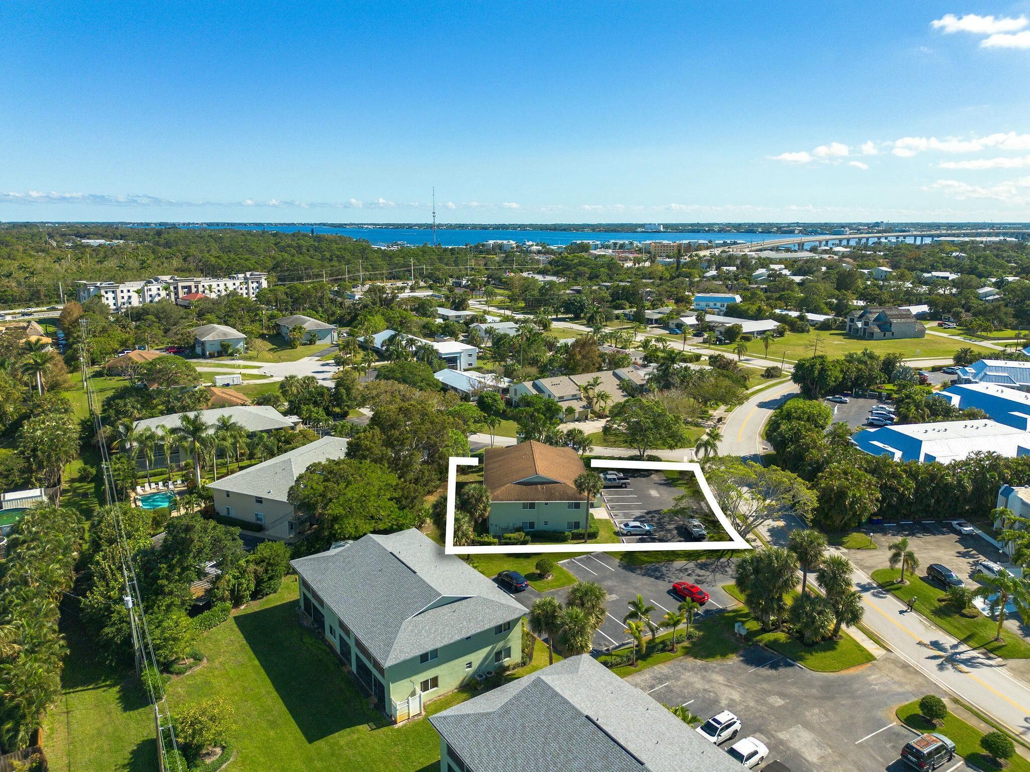 983 Northwest Spruce Ridge Drive, Unit 2 Stuart, FL 34994 - Photo 55 of 55 an aerial view of residential houses with outdoor space