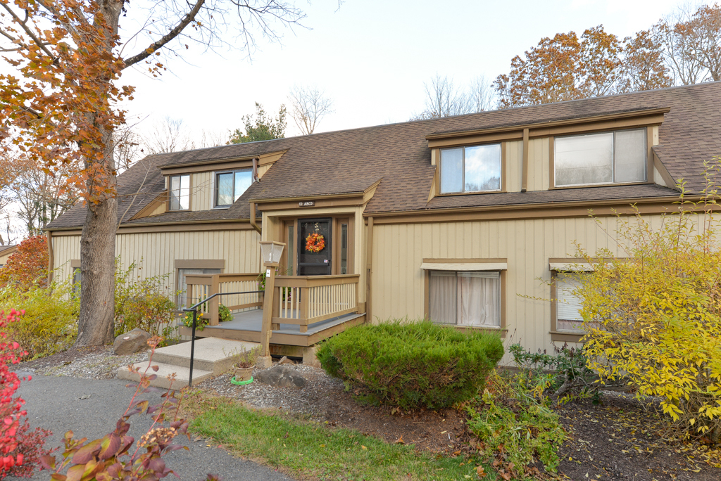 a brick house with a large windows