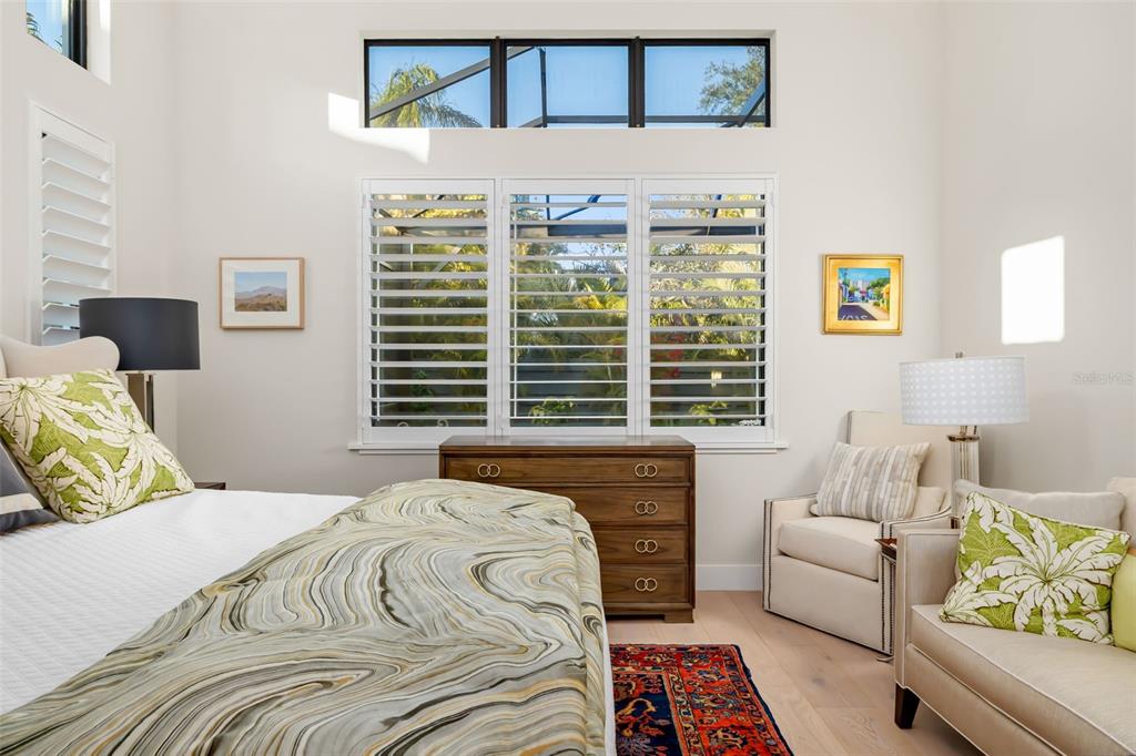 1879 Hibiscus Street Sarasota, FL 34239 - Photo 28 of 84 a bedroom with a bed couch and a window