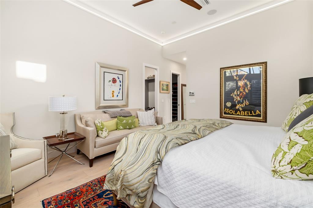 1879 Hibiscus Street Sarasota, FL 34239 - Photo 29 of 84 a bedroom with a bed a couch and painting on the wall