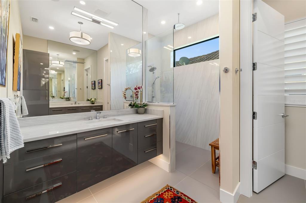 1879 Hibiscus Street Sarasota, FL 34239 - Photo 30 of 84 a bathroom with a double vanity sink mirror and double
