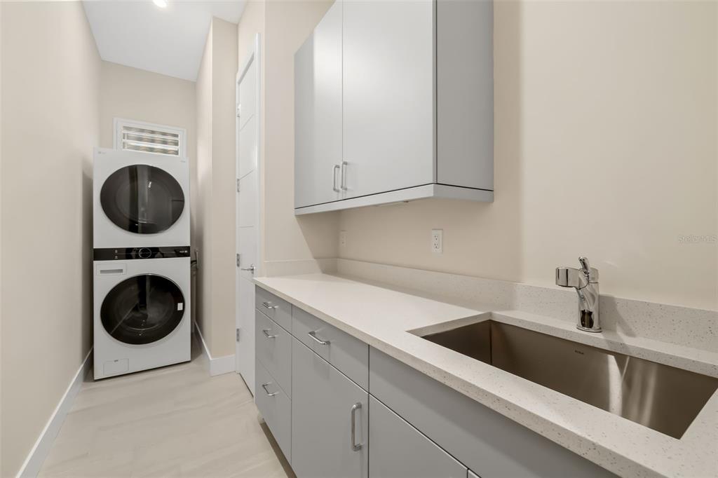 1879 Hibiscus Street Sarasota, FL 34239 - Photo 34 of 84 a utility room with sink dryer and washer