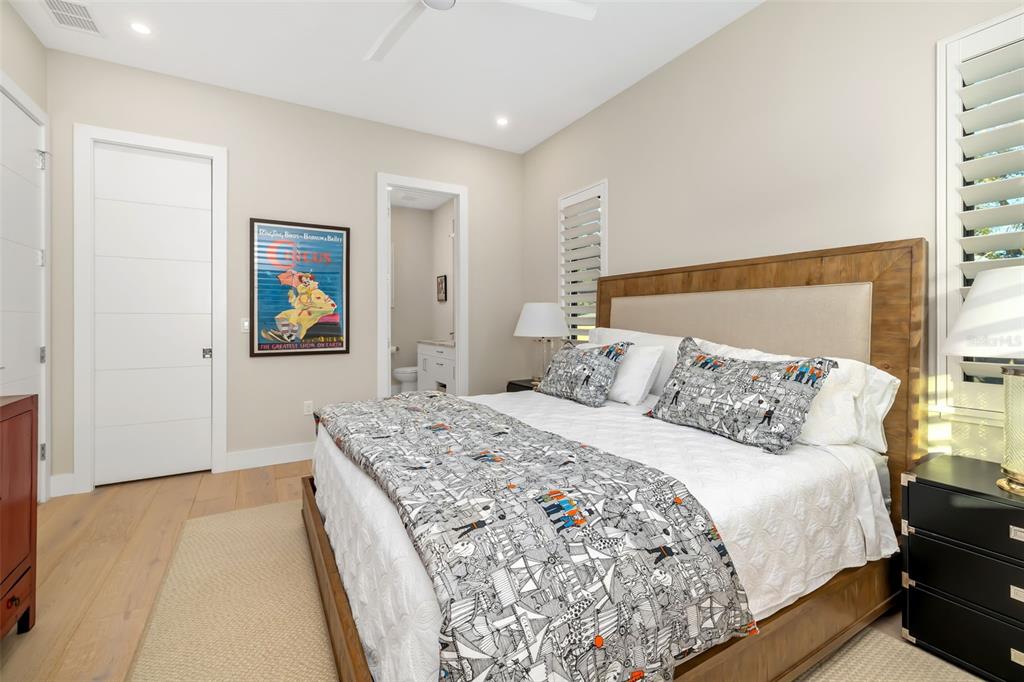 1879 Hibiscus Street Sarasota, FL 34239 - Photo 45 of 84 a bedroom with a bed and painting on the wall