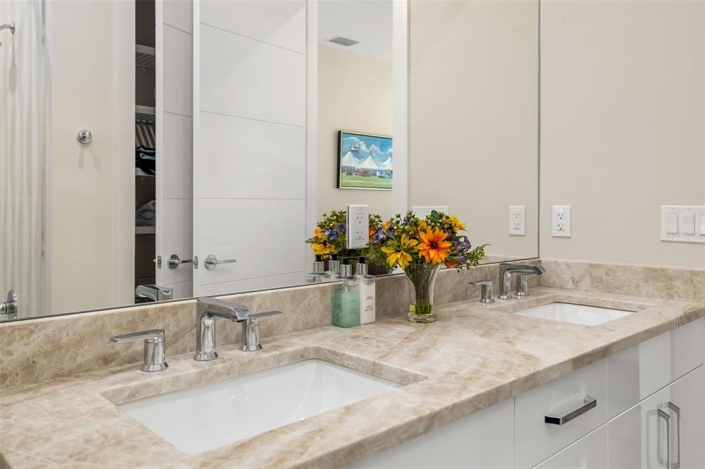 1879 Hibiscus Street Sarasota, FL 34239 - Photo 48 of 84 a bathroom with a sink and a mirror