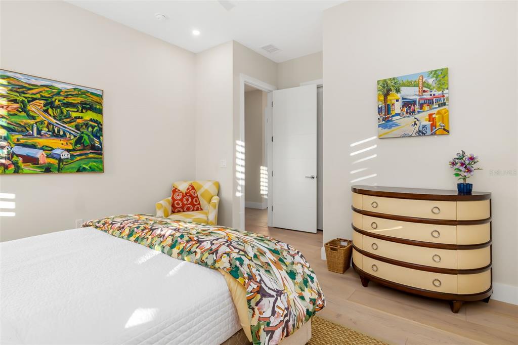 1879 Hibiscus Street Sarasota, FL 34239 - Photo 49 of 84 a bedroom with a bed and a dresser