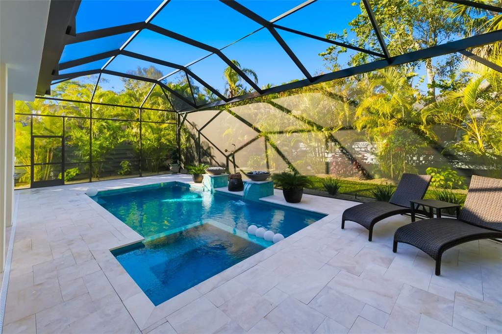 1879 Hibiscus Street Sarasota, FL 34239 - Photo 66 of 84 a view of a swimming pool with a bench in patio