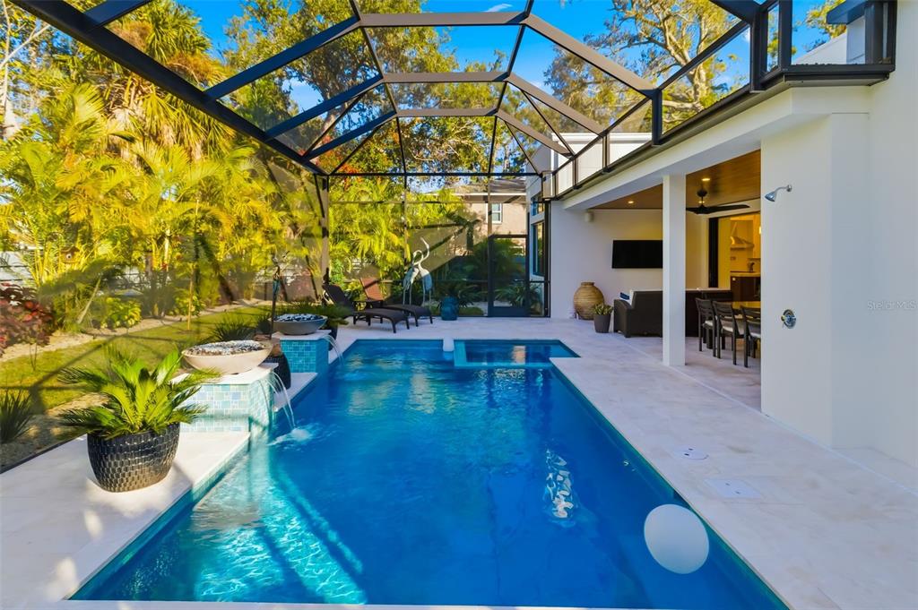 1879 Hibiscus Street Sarasota, FL 34239 - Photo 68 of 84 a view of a swimming pool with potted plants