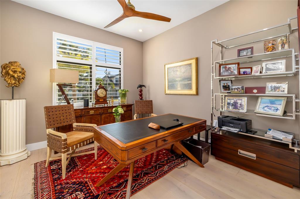 1879 Hibiscus Street Sarasota, FL 34239 - Photo 9 of 84 a living room with furniture a table and a bookshelf