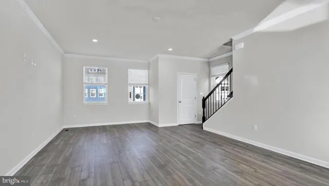 a view of entryway with wooden floor