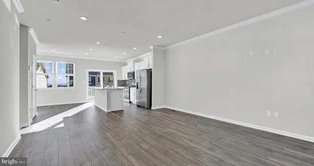 a view of a kitchen with wooden floor