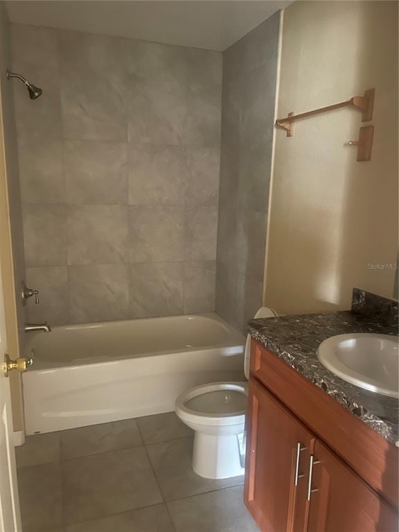 512 Valencia Street Sebring, FL 33870 - Photo 12 of 13 a bathroom with a granite countertop sink toilet and shower