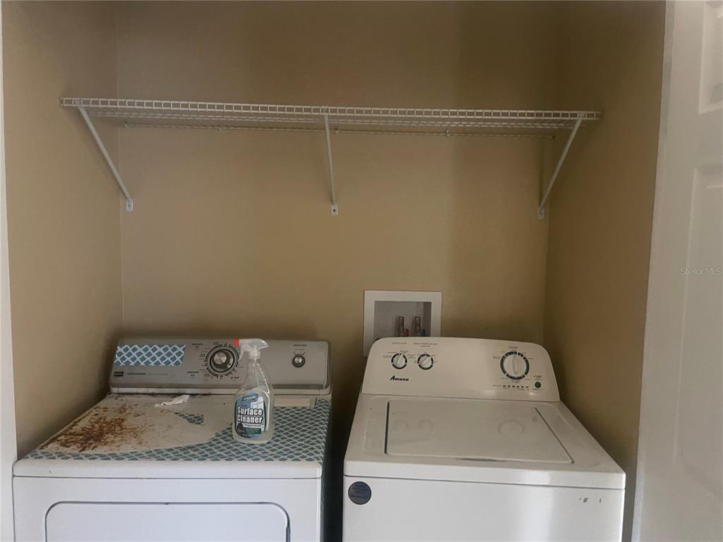512 Valencia Street Sebring, FL 33870 - Photo 7 of 13 a utility room with dryer and washer