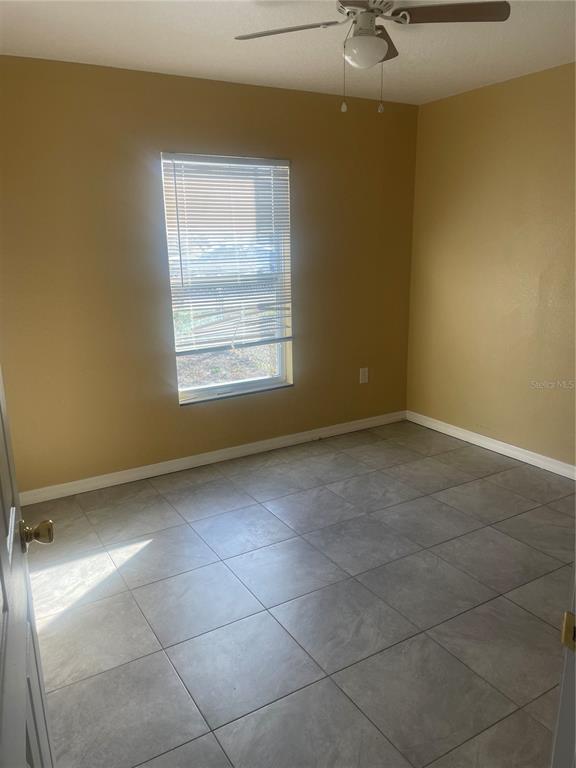 512 Valencia Street Sebring, FL 33870 - Photo 8 of 13 a view of an empty room with a window