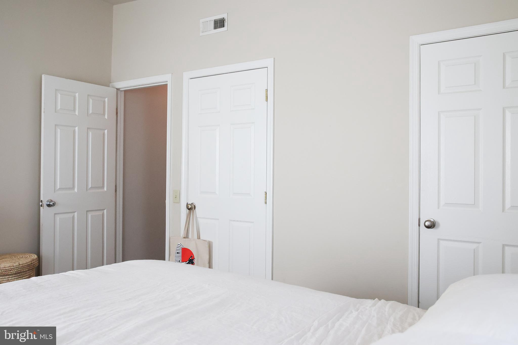 2226 Eutaw Place, Unit 3 Baltimore, MD 21217 - Photo 11 of 15 a bedroom with a bed and a closet