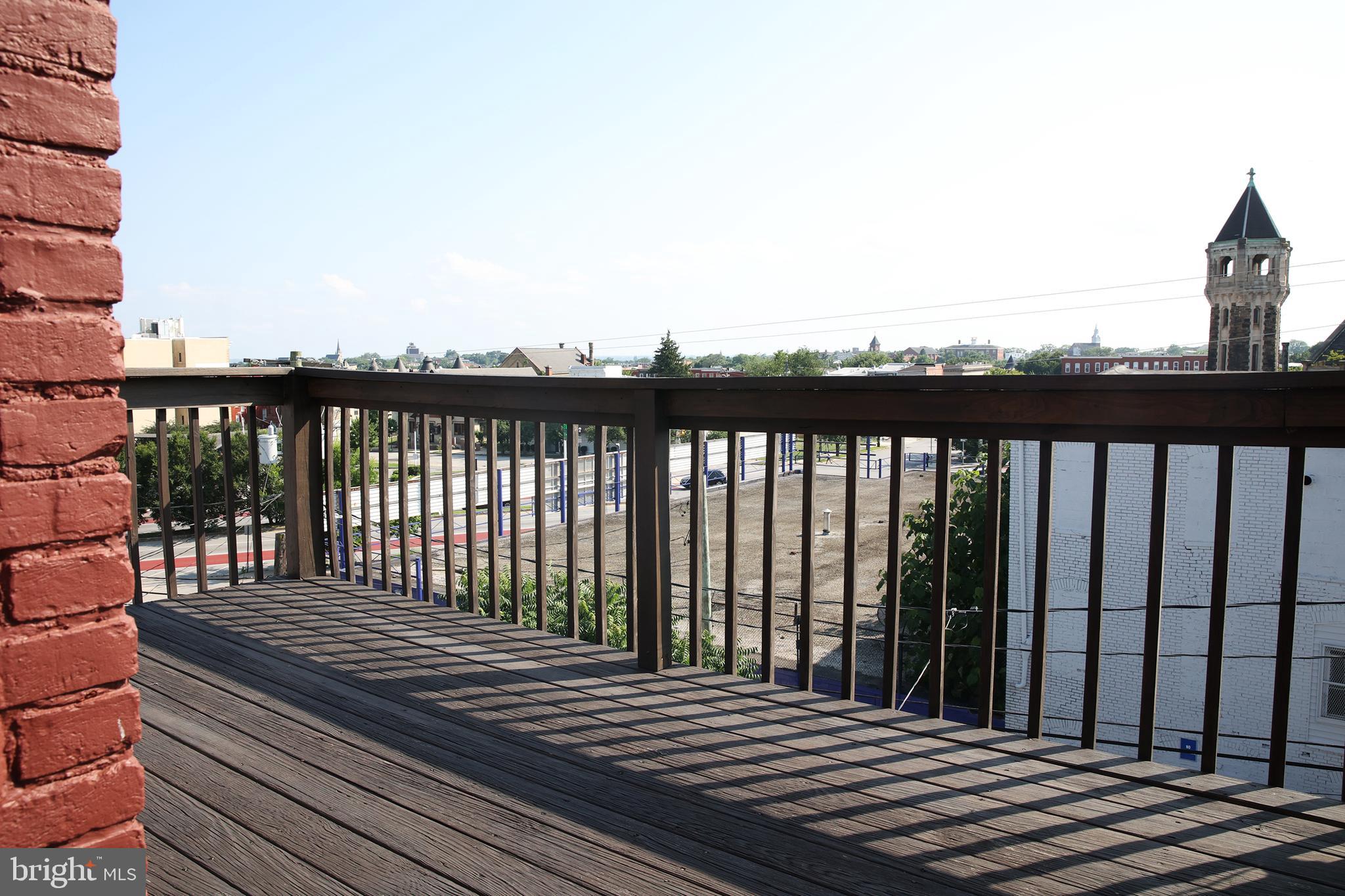 2226 Eutaw Place, Unit 3 Baltimore, MD 21217 - Photo 13 of 15 a view of a balcony with wooden floor