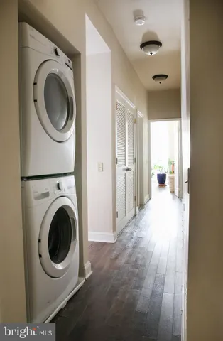 a view of a hallway with washer and dryer