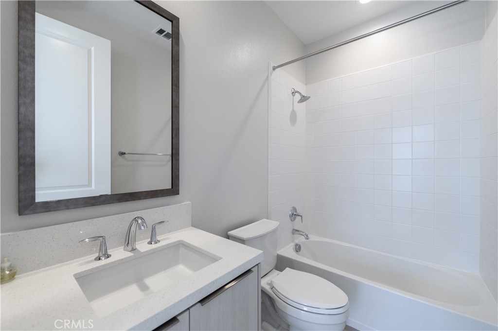 240 Longden Lake Forest, CA 92630 - Photo 24 of 32 a bathroom with a sink toilet vanity and shower