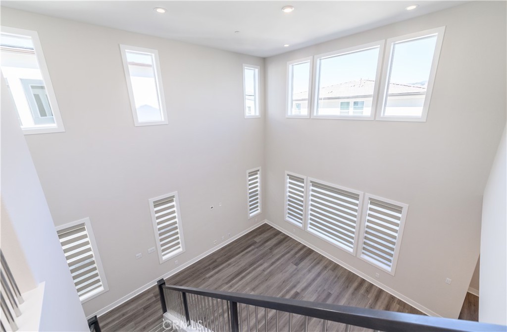 240 Longden Lake Forest, CA 92630 - Photo 28 of 32 a view of wooden floor and windows in a room