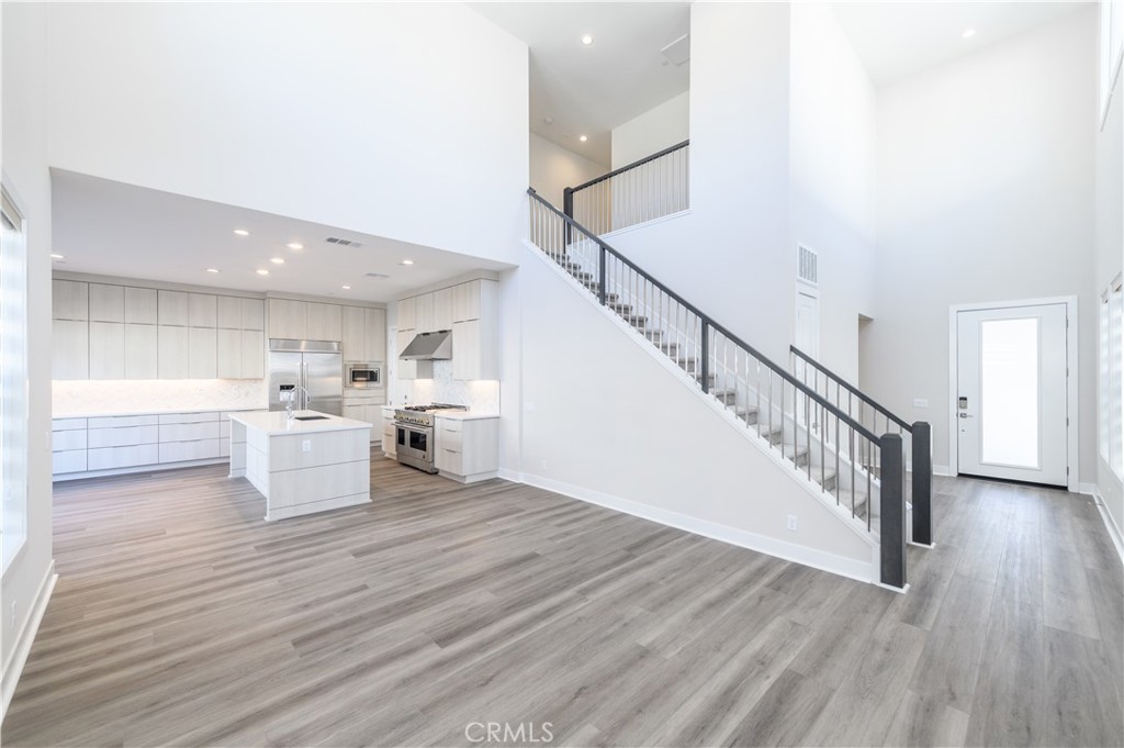 240 Longden Lake Forest, CA 92630 - Photo 4 of 32 a view of a kitchen with wooden floor