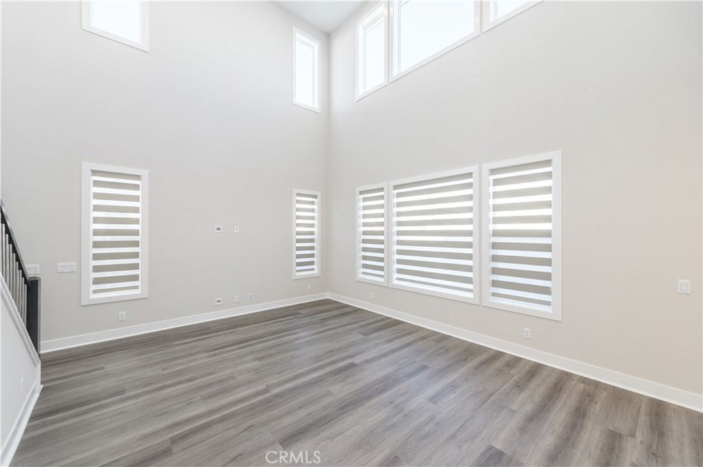 240 Longden Lake Forest, CA 92630 - Photo 5 of 32 a view of an empty room with wooden floor and a window