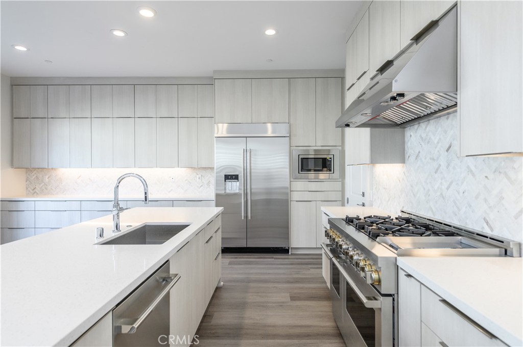 240 Longden Lake Forest, CA 92630 - Photo 9 of 32 a kitchen with stainless steel appliances granite countertop a sink stove and refrigerator