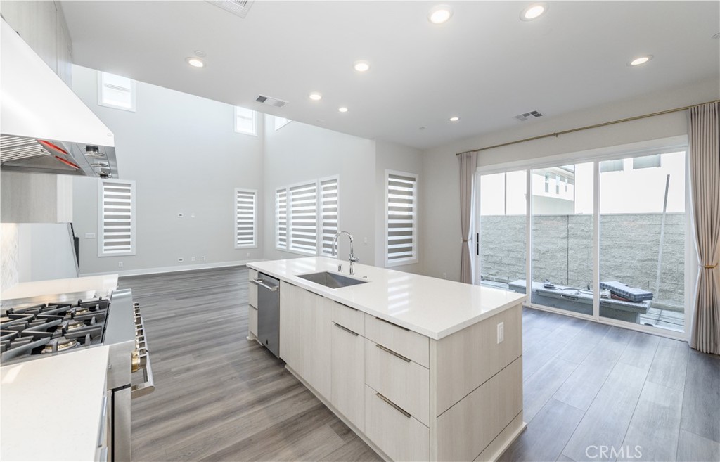 240 Longden Lake Forest, CA 92630 - Photo 10 of 32 a large white kitchen with a large window