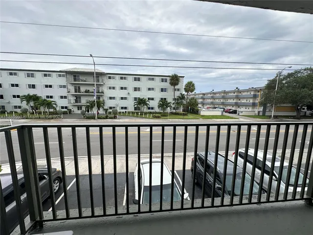 an entryway view with a wooden fence