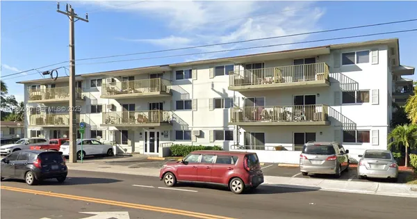 a view of a cars parked in front of a building