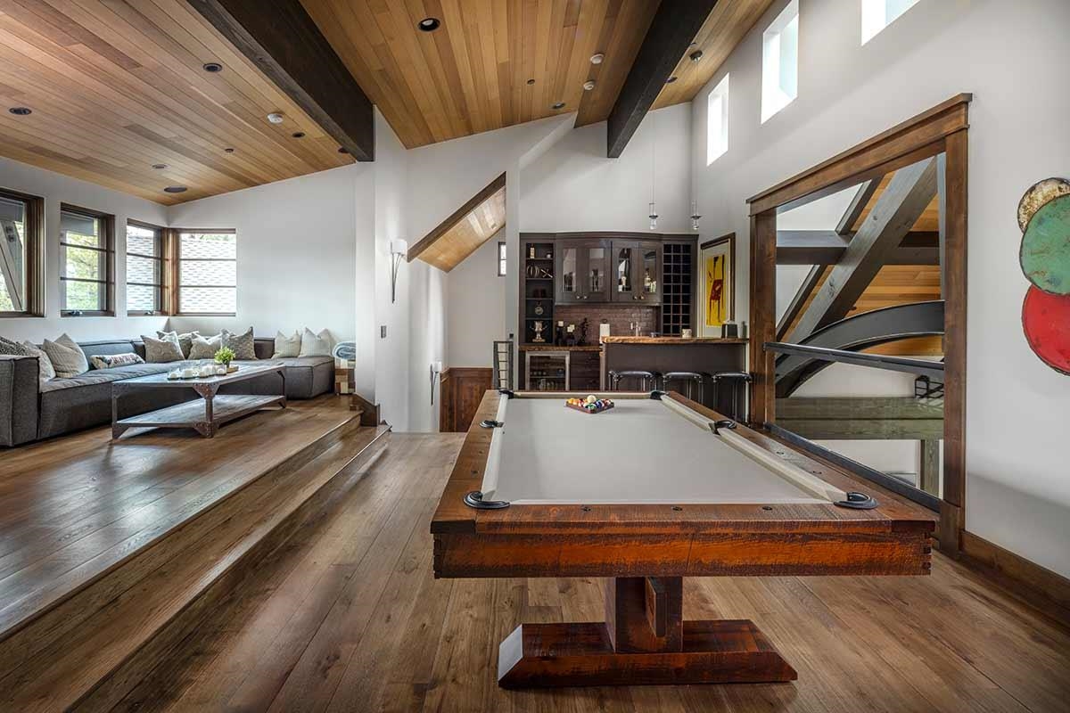 9619 Dunsmuir Way Truckee, CA 96161 - Photo 17 of 24 a living room with furniture a rug and a chandelier