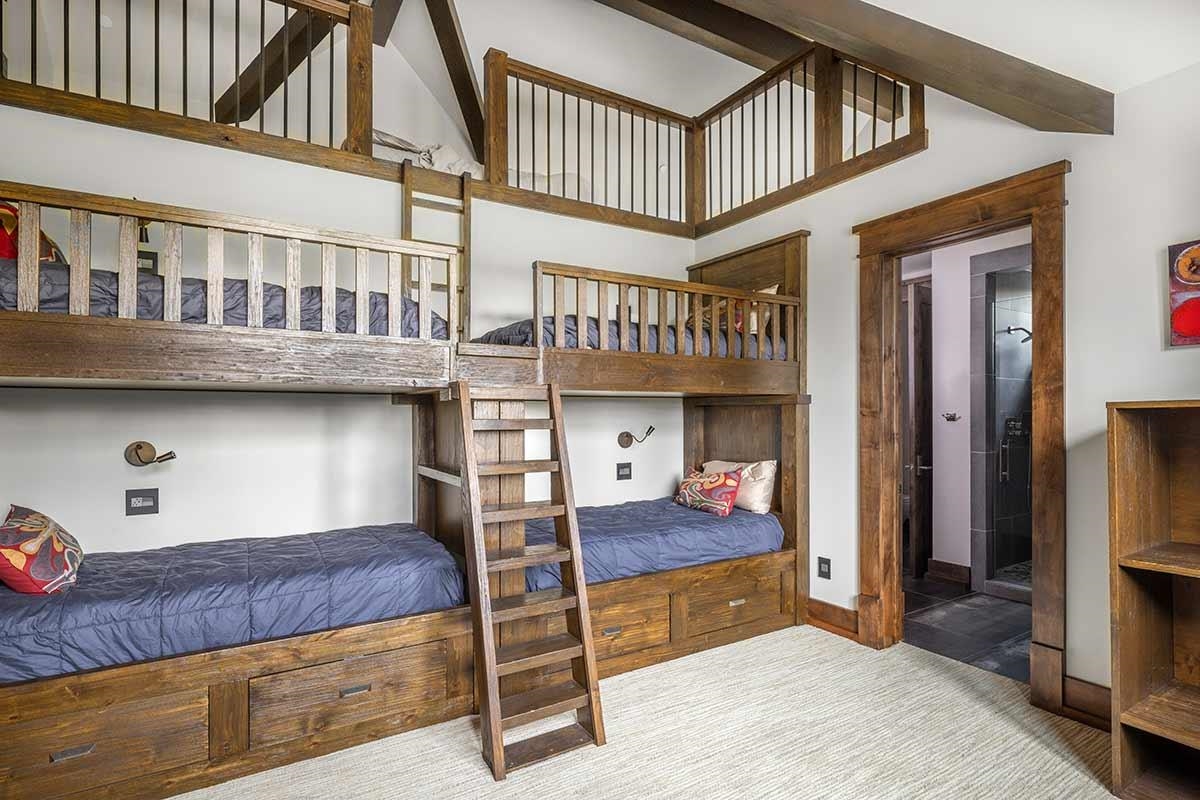 9619 Dunsmuir Way Truckee, CA 96161 - Photo 18 of 24 a bedroom with bed and a large window