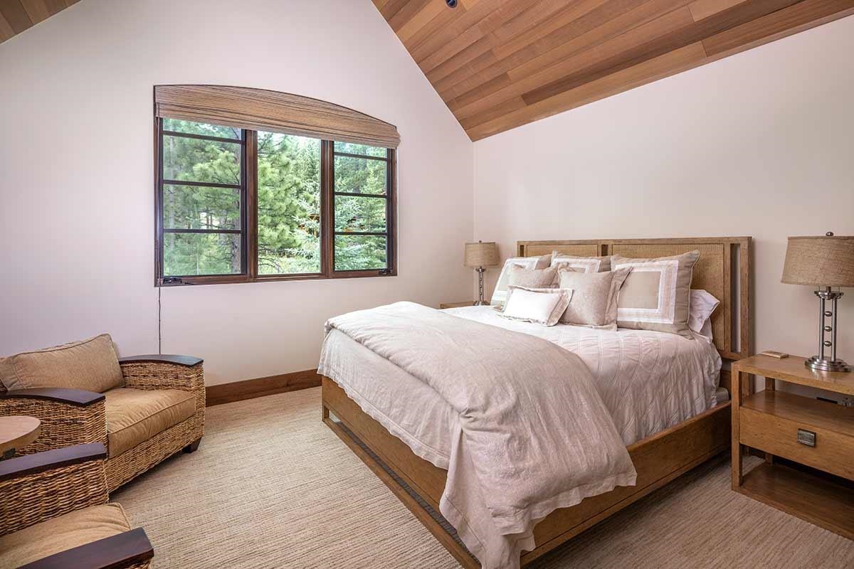 9619 Dunsmuir Way Truckee, CA 96161 - Photo 19 of 24 a bedroom with a bed couch and window