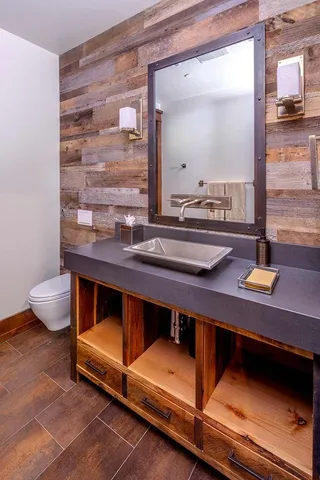 a room with pool table and chairs
