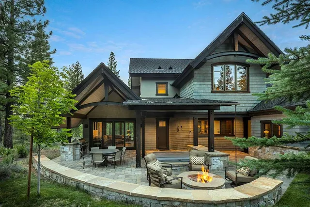 a front view of house with yard outdoor seating and garage