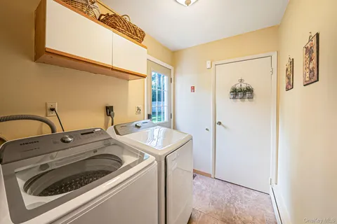 a utility room with dryer and washer