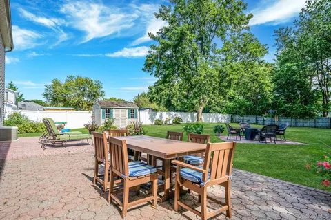 a view of a dining space with furniture and garden