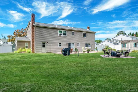 a view of a house with a back yard