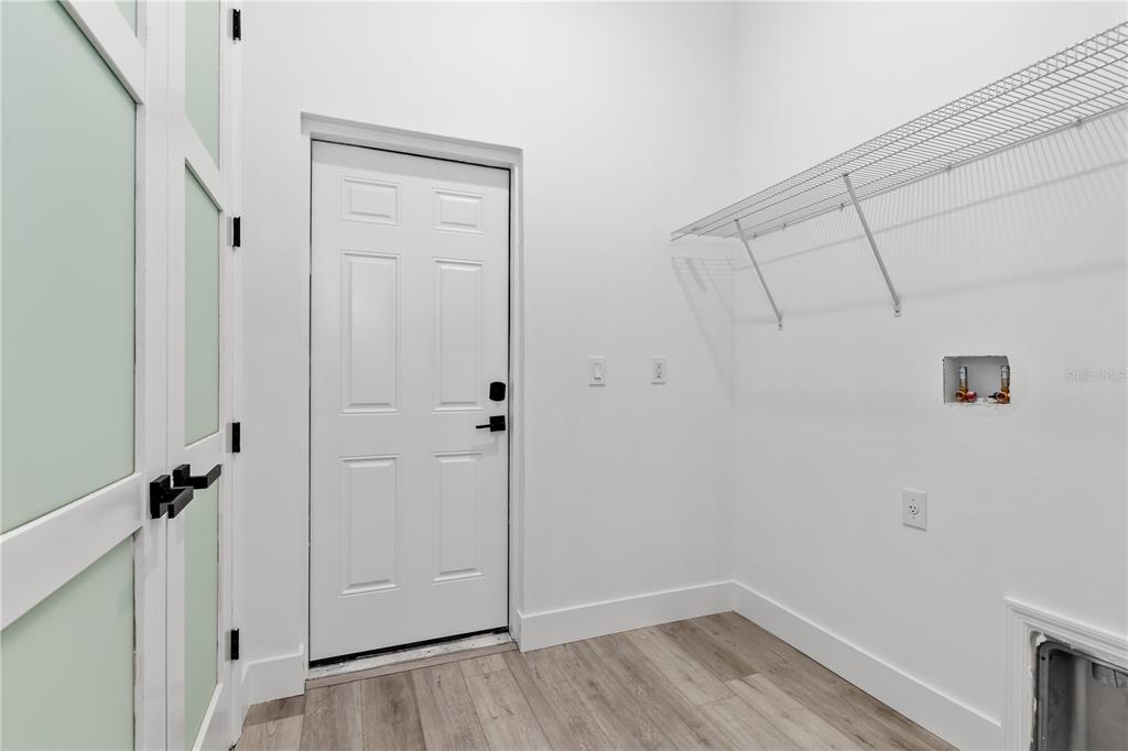 13514 Keystone Boulevard Port Charlotte, FL 33981 - Photo 23 of 42 a view of a room with wooden floor