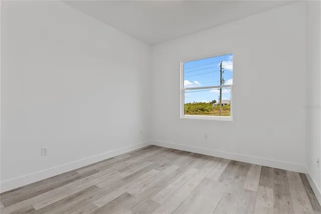 a view of a room that has wooden floor and walls