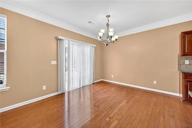 a open kitchen with stainless steel appliances granite countertop a stove and a sink