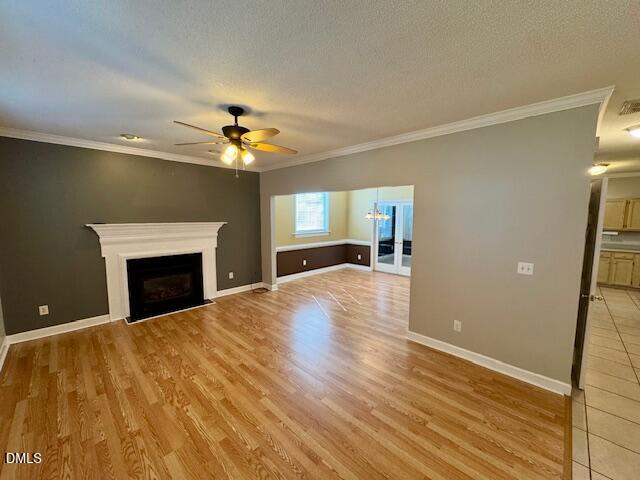 813 St Catherines Drive Wake Forest, NC 27587 - Photo 2 of 16 a view of an empty room with a fireplace and a chandelier fan