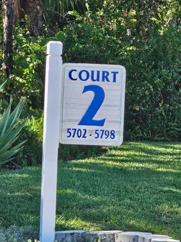 a sign that is on the side of a road