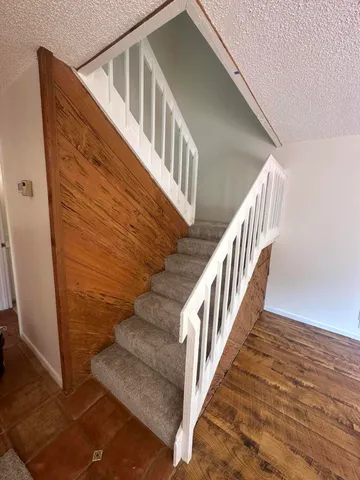 a view of entryway with wooden floor